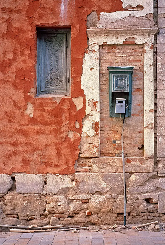 windows-and-mail-boxes-on-the-outside-wall-of-an-old-building