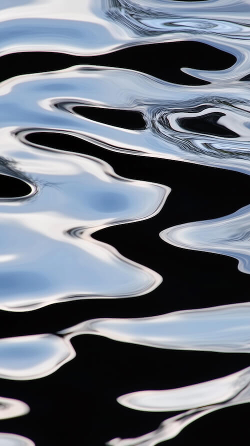 abstract-reflection-of-water-ripples-on-a-black-background